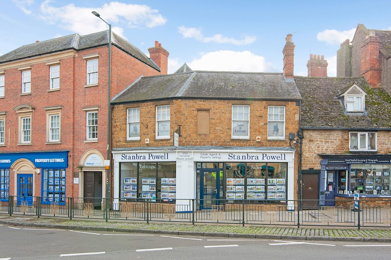 Street view of Stanbra Powell estate and letting agents in a row of traditional buildings.